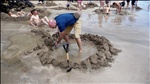 Digging our hot pool on Hot Water Beach